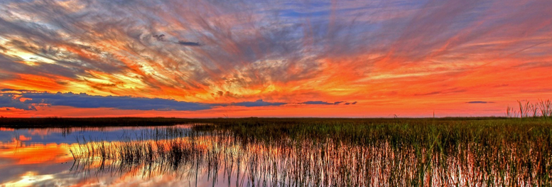 Sunlit sky over water